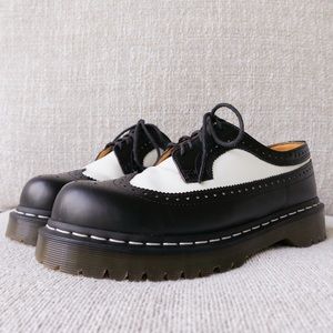 Dr. Martens Black and White Flats with Brogue Detailing